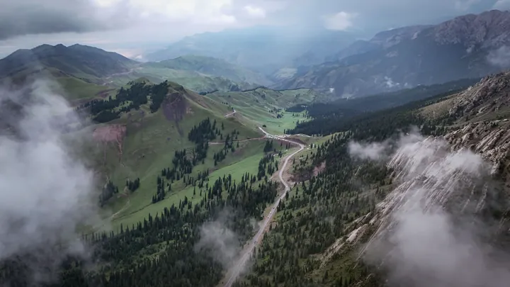 Green mountain valleys beneath low clouds